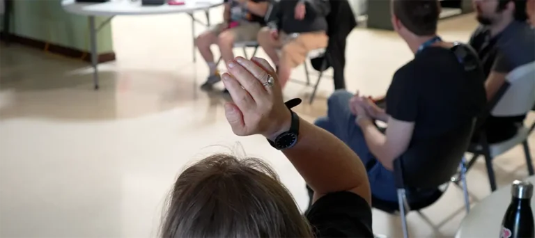 woman raising hand