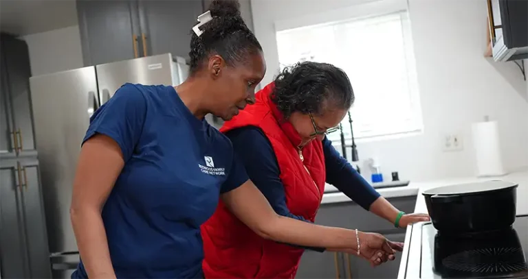 two people cooking together