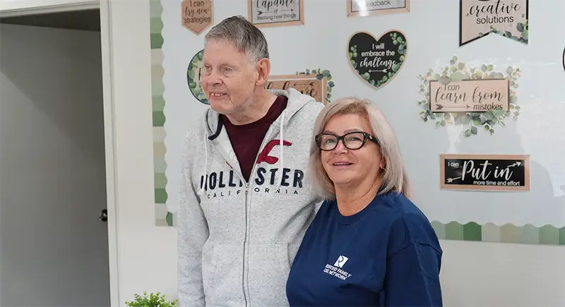 two people standing together