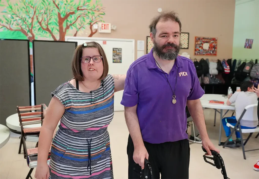 woman with her arm on man's back