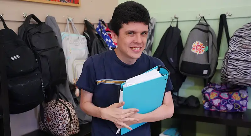 young man with a binder