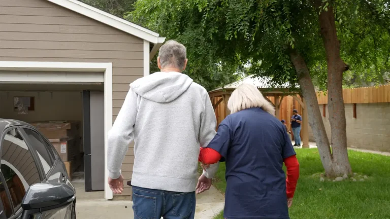 caregiver walking with patient