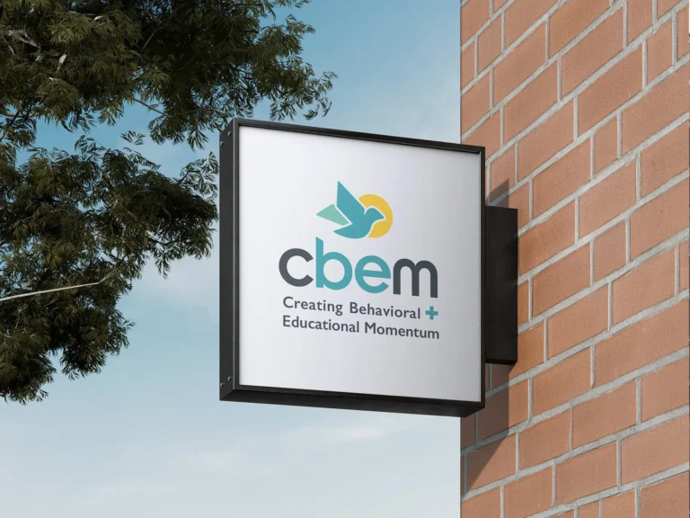 CBEM sign outside on brick wall