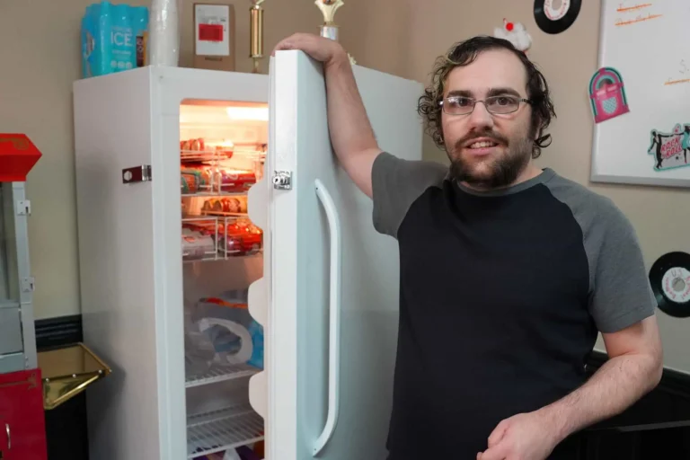 Man opening refrigerator
