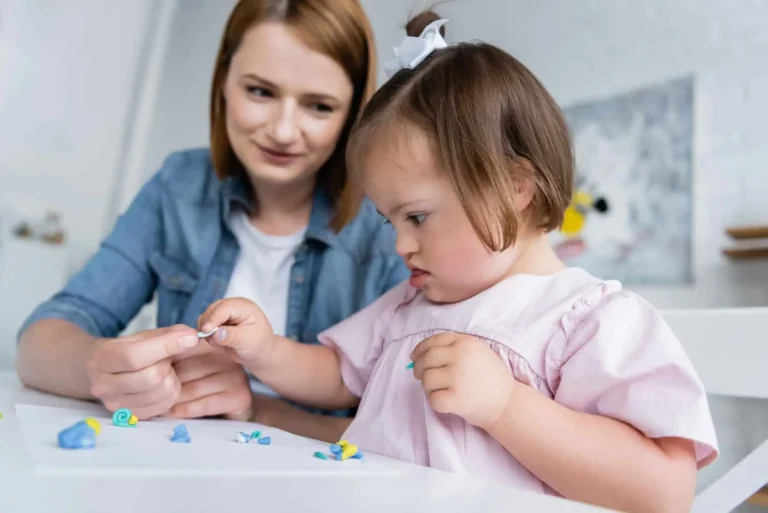 Mom and daughter playing with clay