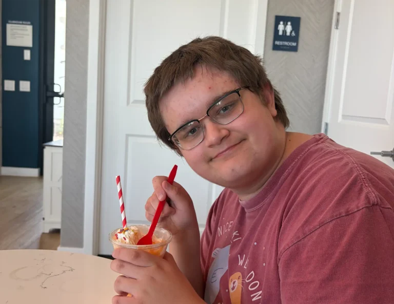 youth eating an ice cream dessert