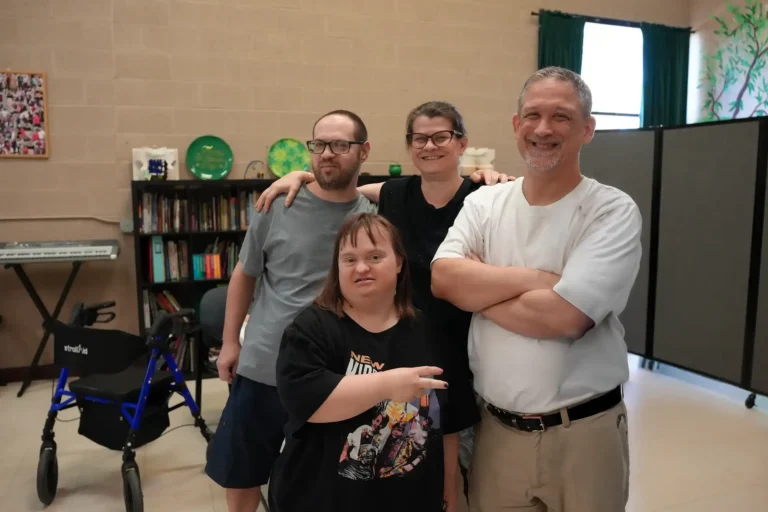 group of individuals with caretaker smiling